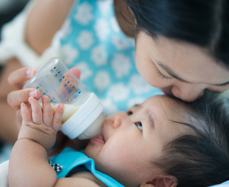 mom feed power mile to her baby, new born and mother conceptの写真素材