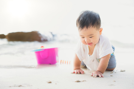 Asan baby play on the beach in Koh Kood, Koh Kood is island in Thailand. This images can use for kid, baby, play, resort, family and travel conceptの写真素材