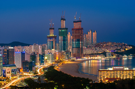 Busan beach view from roof top of hotel in Busan city in night time with blue sky and full moon, South Korea, this picture can use for tavel, Busa, South Korea and  city conceptのeditorial素材