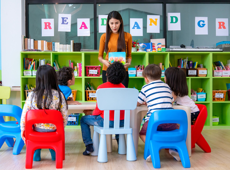 Asian Teacher lady in preschool teaching her student in classroom. this immage can use for education, school, and job conceptの写真素材