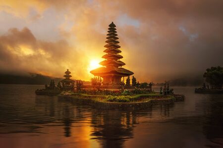 sunset in Pura Ulun Danu Bratan temple in Bali, beautiful traditional architecture of Indonesiaの写真素材