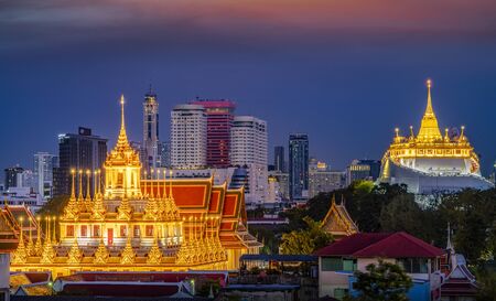 cityscape of Loha prasat and Golden mountain with Bangkok city background view in twilight time from the rooftop of hotel in Bangkok, Thailandのeditorial素材