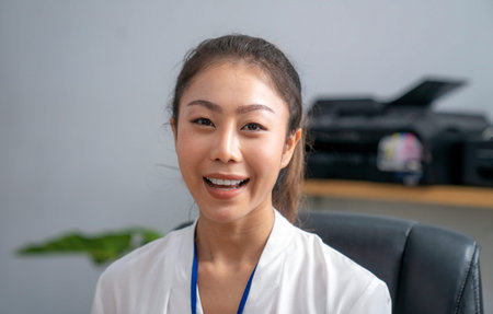 Asian business woman talking in her office , this image can use for business, online meeting concept