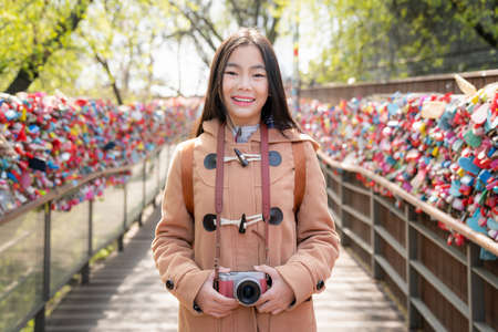 Asian wonan traveler visit Seoul N tower park and enjoy key and lock icom in this point, seoul city, south Koreaの写真素材