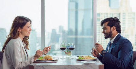 European couple take lunch togather in Italian restaurant and eating spaghetti on the table with...