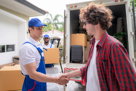 Workers unloading boxes from van outdoors. Moving service and customer need for move to new houseの写真素材