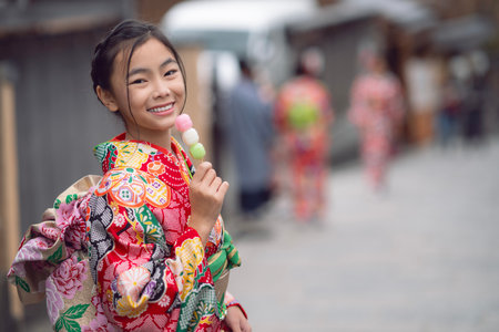 Asian traveler girl in Kimono traditional dress walking in old temple in Kyoto city, Japanの写真素材