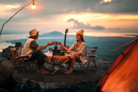 Asian couple sweet in tent inside on they camping trip, traveller relax and sleep togather in out door and camping tripの写真素材