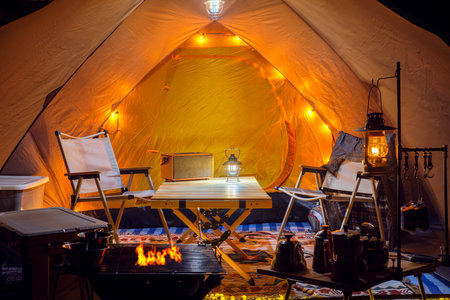 Inside of tent in camping, too many assessories and decoration for cooking, cofee and working between travel in camping tripの写真素材