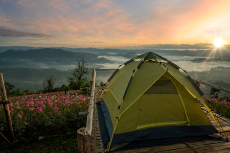 mon mok tawan, tent and camping at Tak with fog mountain and sun rise backgroung, Mon Saeng Tawan, Tak, Thailandの写真素材