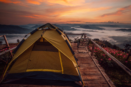 mon mok tawan, tent and camping at Tak with fog mountain and sun rise backgroung, Mon Saeng Tawan, Tak, Thailandの写真素材