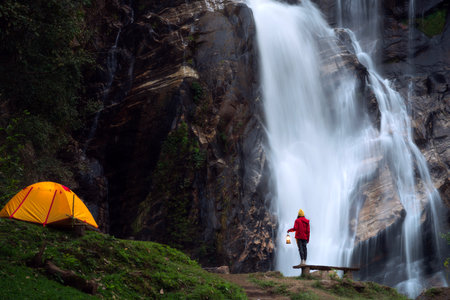 Light and campfire on night time at Mae tear waterfall near Doi inthanon in Chiang mai, Northen, Thailandの写真素材