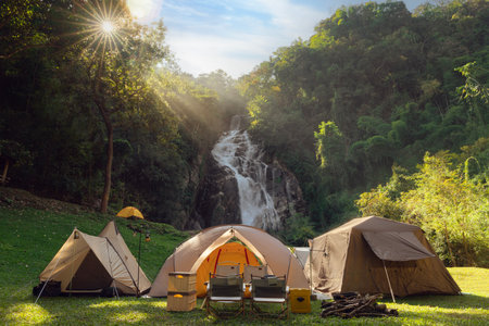 Tent and camping with Mae Tia waterfall and mountain background at inthanon national park in Chiang mai, Thailand, un seen travel point for camping and relax in holidayの写真素材