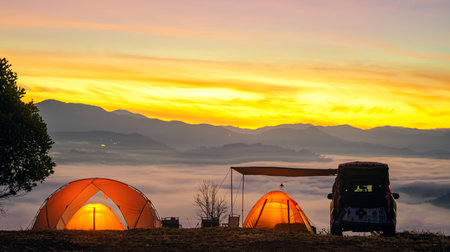 Orange tent in camping area in top of Mea Omgi at Tak, North of Thailand in winter season and balloon, Laandscape view point in travel point near Chiang mai, Thailandの写真素材