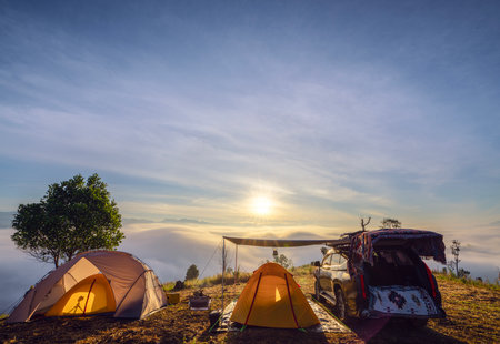 Orange tent in camping area in top of Mea Omgi at Tak, North of Thailand in winter season and balloon, Laandscape view point in travel point near Chiang mai, Thailandの写真素材