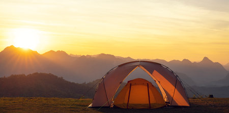 Orange tent in camping area in top at Tak, North of Thailand in winter season, Laandscape view point in travel point near Chiang mai, Thailandの写真素材