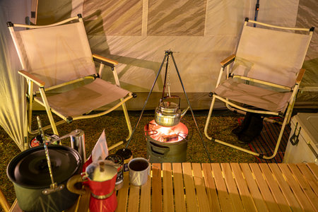 Inside of tent in camping, too many assessories and decoration for cooking, cofee and working between travel in camping tripの写真素材