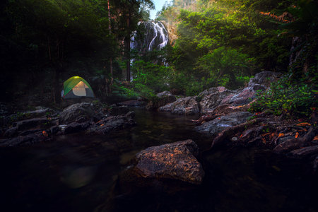 Tent and camping with Klonglan water fall in Khlong Lan National Park in Kamphaeng Phet near Chiang mai, Thailand, un seen travel point for camping and relax in holidayの写真素材