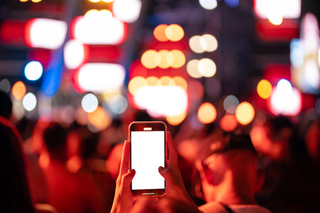 people take live video to online app and show in social by two hands and smart phone with concert backgroundの写真素材