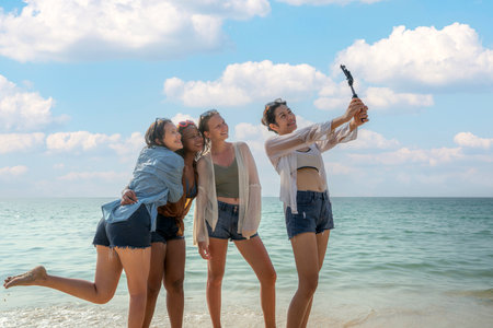 American teen age play and relax together on the beach on summer timeの写真素材