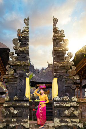 Indonesian girl with traditional costumn dance in bali temple, indonesiaの写真素材