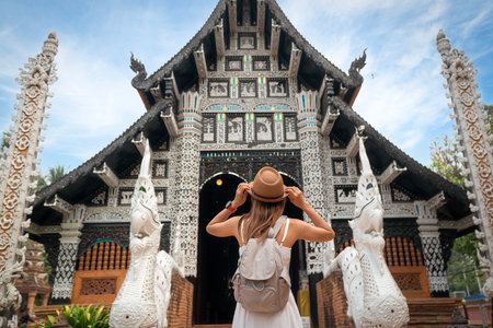 Asian traveller take a photo to Pagoda of wat lok moli temple in Chiang mai city, Thailandの写真素材