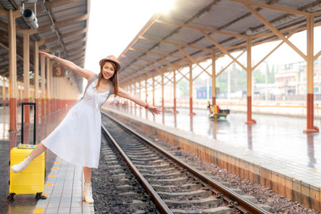 Asian traveller use n95 mask for prevent dust from pm at Chiang mai train station, Thailandの写真素材