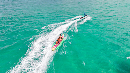 Group of Banana boat play on the beach in Phuket island, Thailandの写真素材