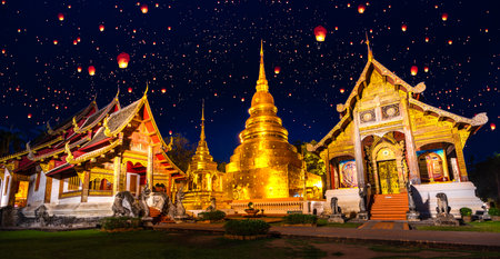 wat phra singh temple in night time in raining season in Chiang mai city, Thailandの写真素材
