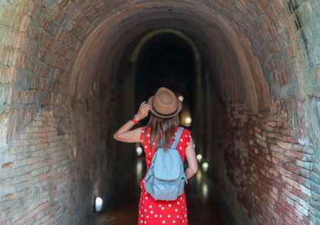 Asian woman traveller in white dress travel in wat Umong temple in Chiang mai city, Tahilandの写真素材