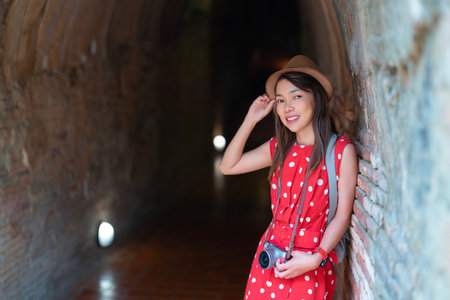 Asian woman traveller in white dress travel in wat Umong temple in Chiang mai city, Tahilandの写真素材