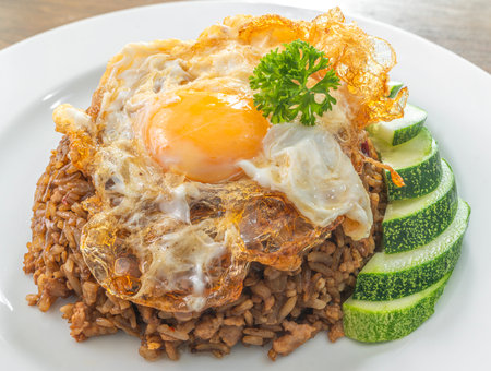 Basil Rice with Fried Egg in white dish to order from food delivery app, noline order from application for Thai traditional foodの写真素材