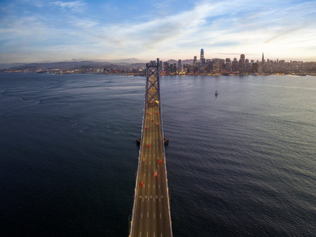 Cityscape view of San Francisco and the Bay Bridge with Colorful Sunset from island, California, USA