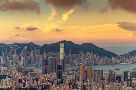 Cityscape for Hong kong city with mid night time to morning sunrise time and victoria mountain,...