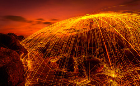 Dancer show swimg the fire of steelwool on the beach in party in bar and  restaurant at Phuket island, Thailandの写真素材