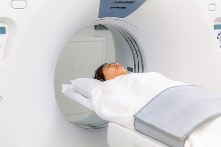 Asian woman patient check up her body by ct scan machine, ct scanner for examination health checkup in hospitalの写真素材