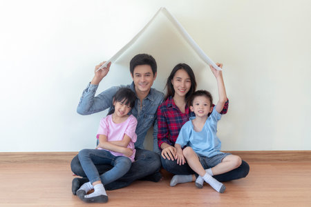 Asian family sit togather in new house with home icon concept, dream homeの写真素材