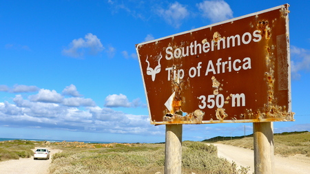 Old weathered sign for the national park, the southernmost point of Africa, Cape Agulhasの写真素材