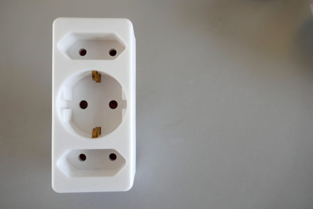 White triple socket on gray background