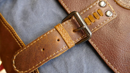 Metal closure of a leather bag, close-up