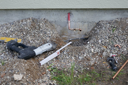 Faucet on a house wall with adapters for a garden hose