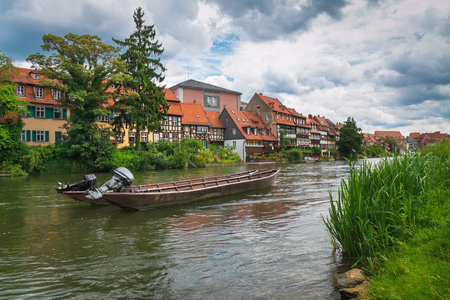 Beautiful summer landscape of the city with beautiful old houses near the river. An ancient German...
