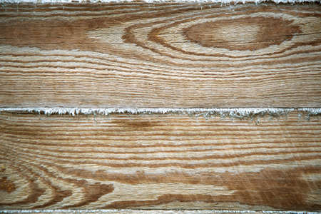 Textured background of wood. Pine and spruce boards and beams for house construction. Insulation of rural homes with strip of linen.の写真素材
