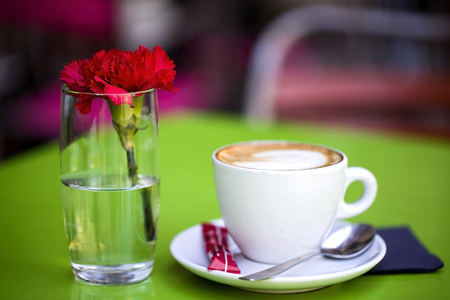 Coffee cup on the table and bokeh backgroundの写真素材