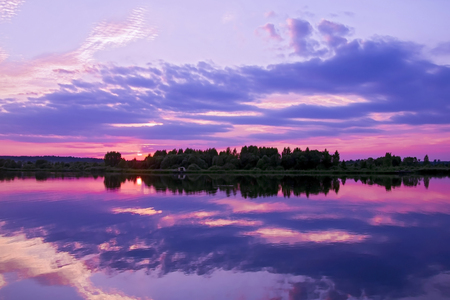 Panorama of the reflection of the sunset in the lake.の写真素材