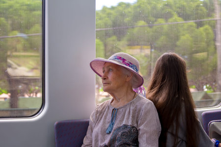 Senior woman on train journeyの写真素材