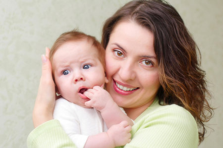 Mother keeps son in his hands