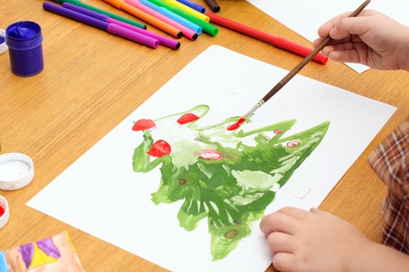 child draws a tree; hands, paint, markersの写真素材