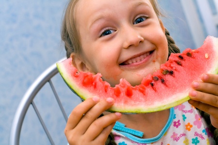 girl eat ripe watermelonの写真素材