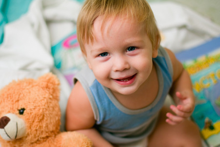 portrait of a boy with bearの写真素材
